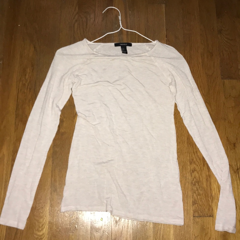 Casual and soft cream-colored long sleeve top